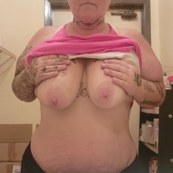 Amber with her tits out at work